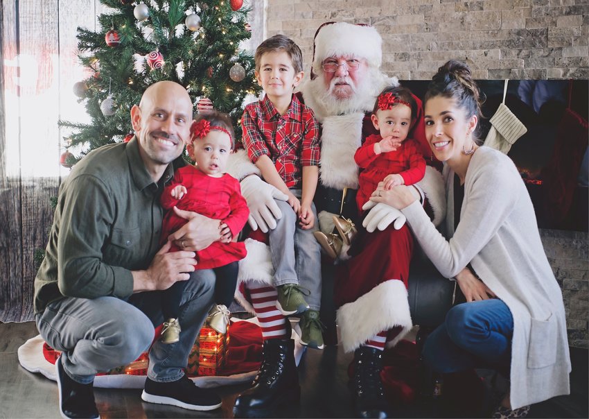 The Conley family with Santa when the twins were toddlers.